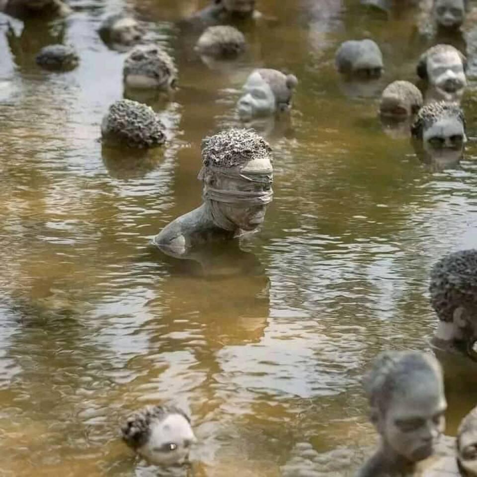 Ghanaian artist creates haunting sculptures of slaves in Accra lake